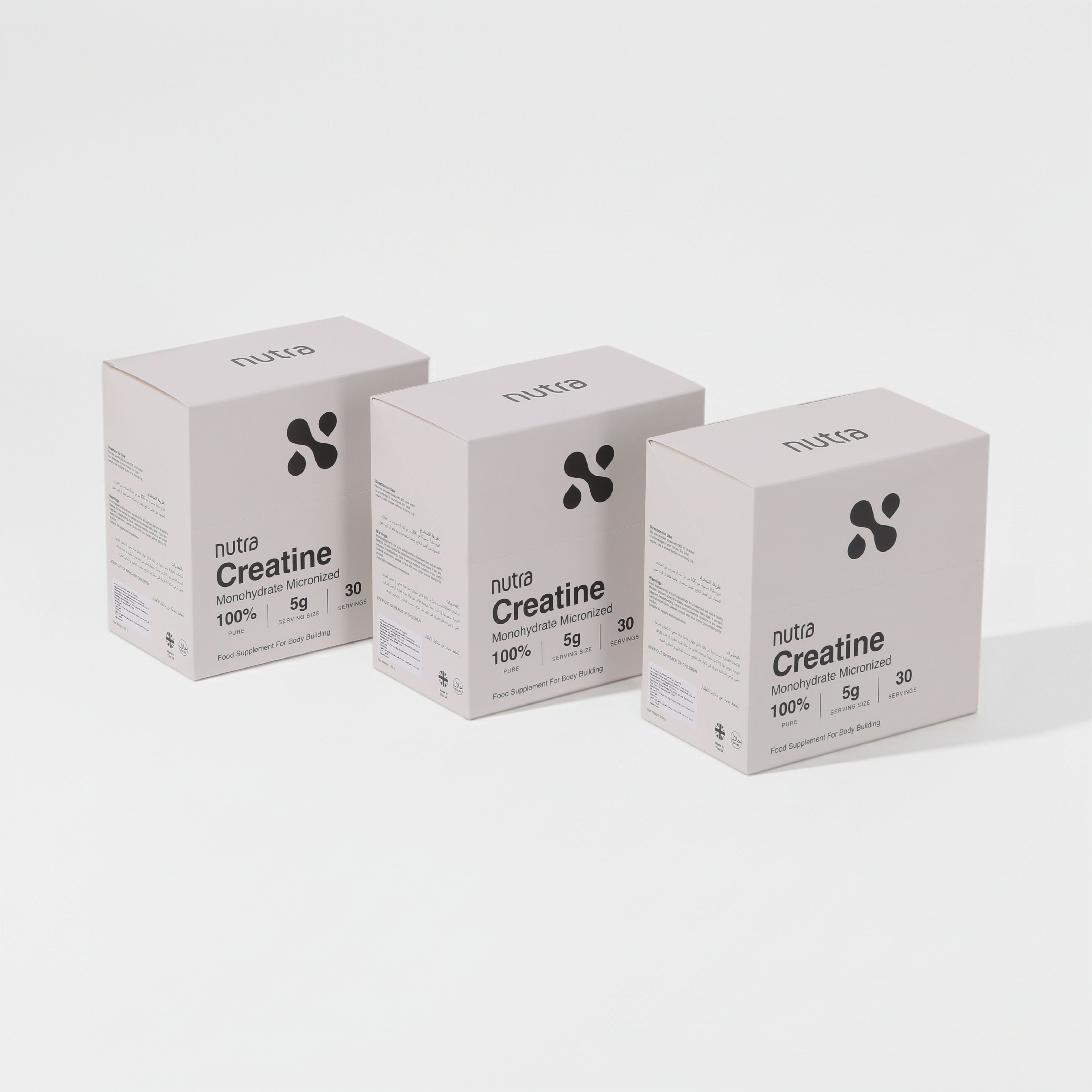 Three boxes of 'nuta Creatine' on a white background